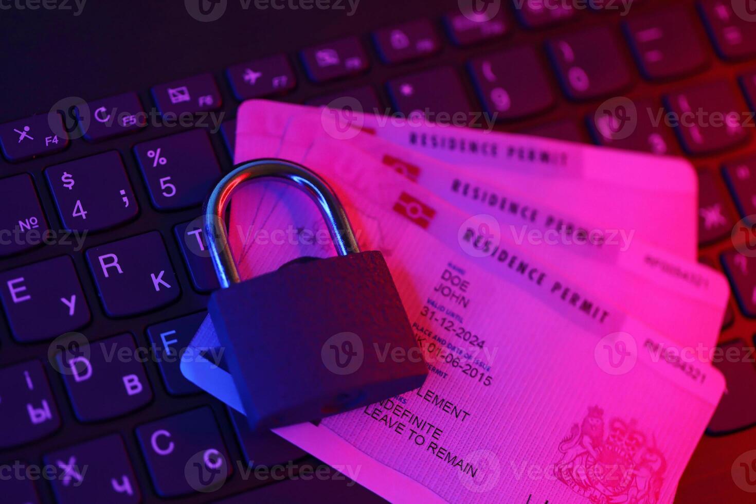 BRP Residence Permit card with small padlock on computer keyboard photo