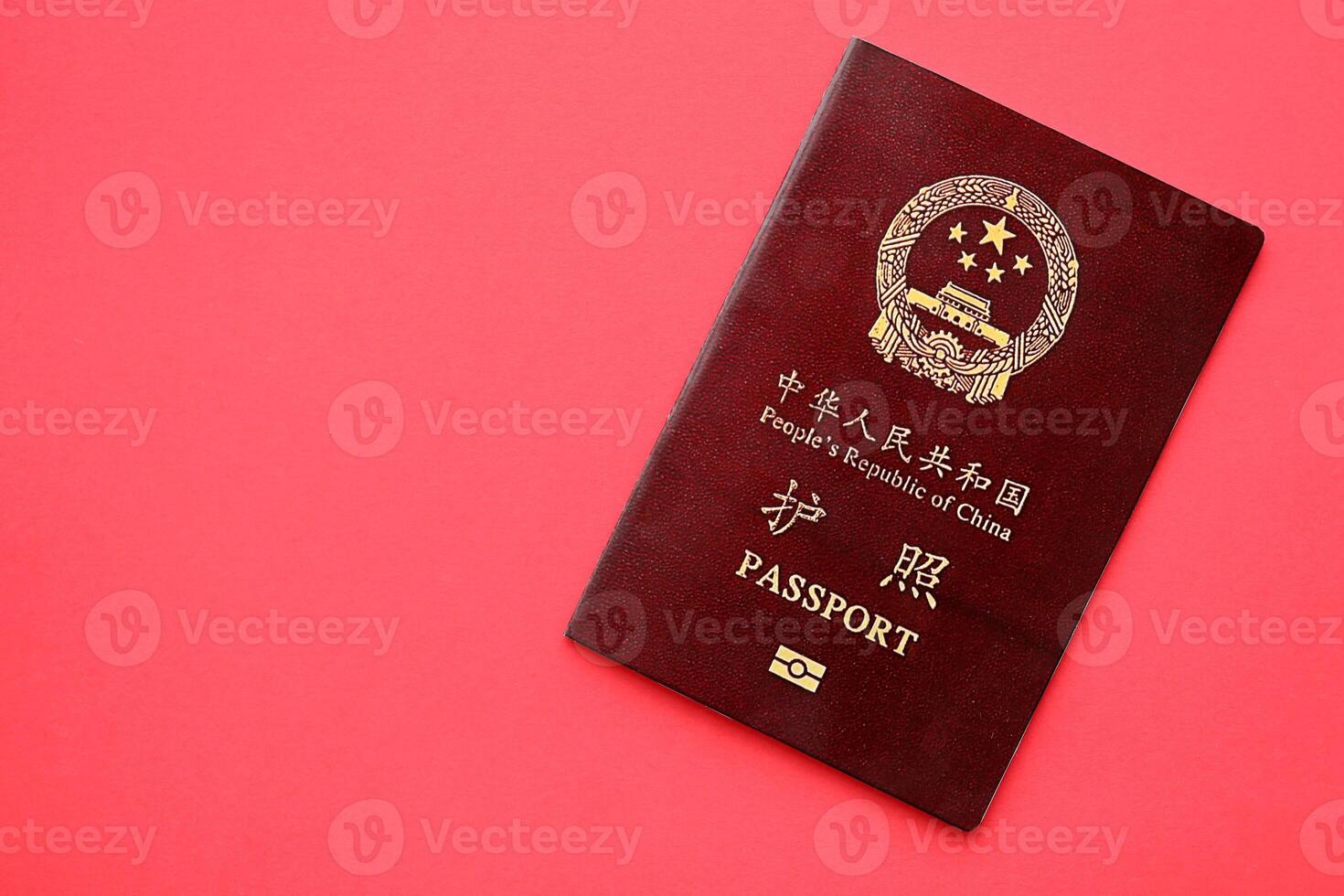 Red passport of People Republic of China. PRC chinese passport on bright background photo