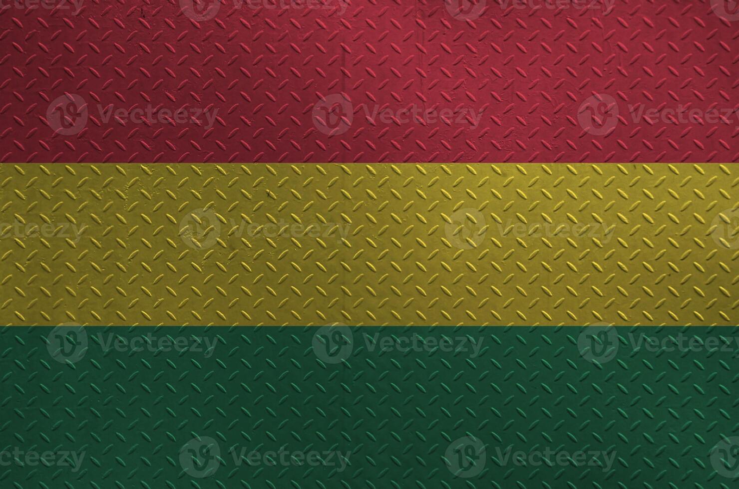 Bolivia flag depicted in paint colors on old brushed metal plate or wall closeup. Textured banner on rough background photo