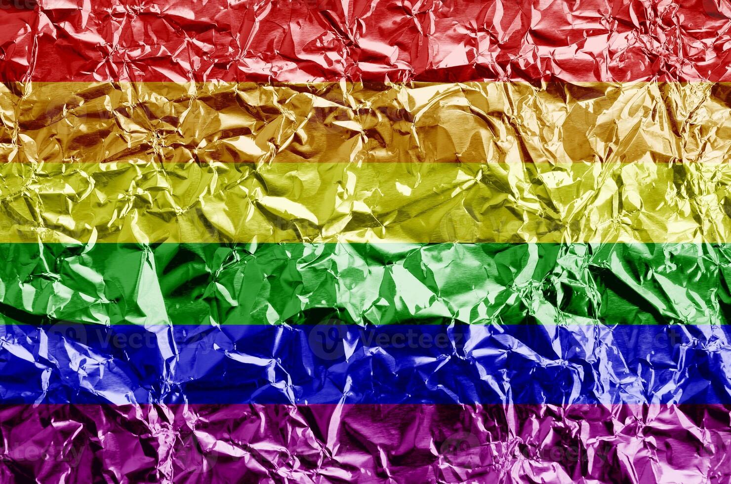 LGBT community flag depicted in paint colors on shiny crumpled aluminium foil closeup. Textured banner on rough background photo