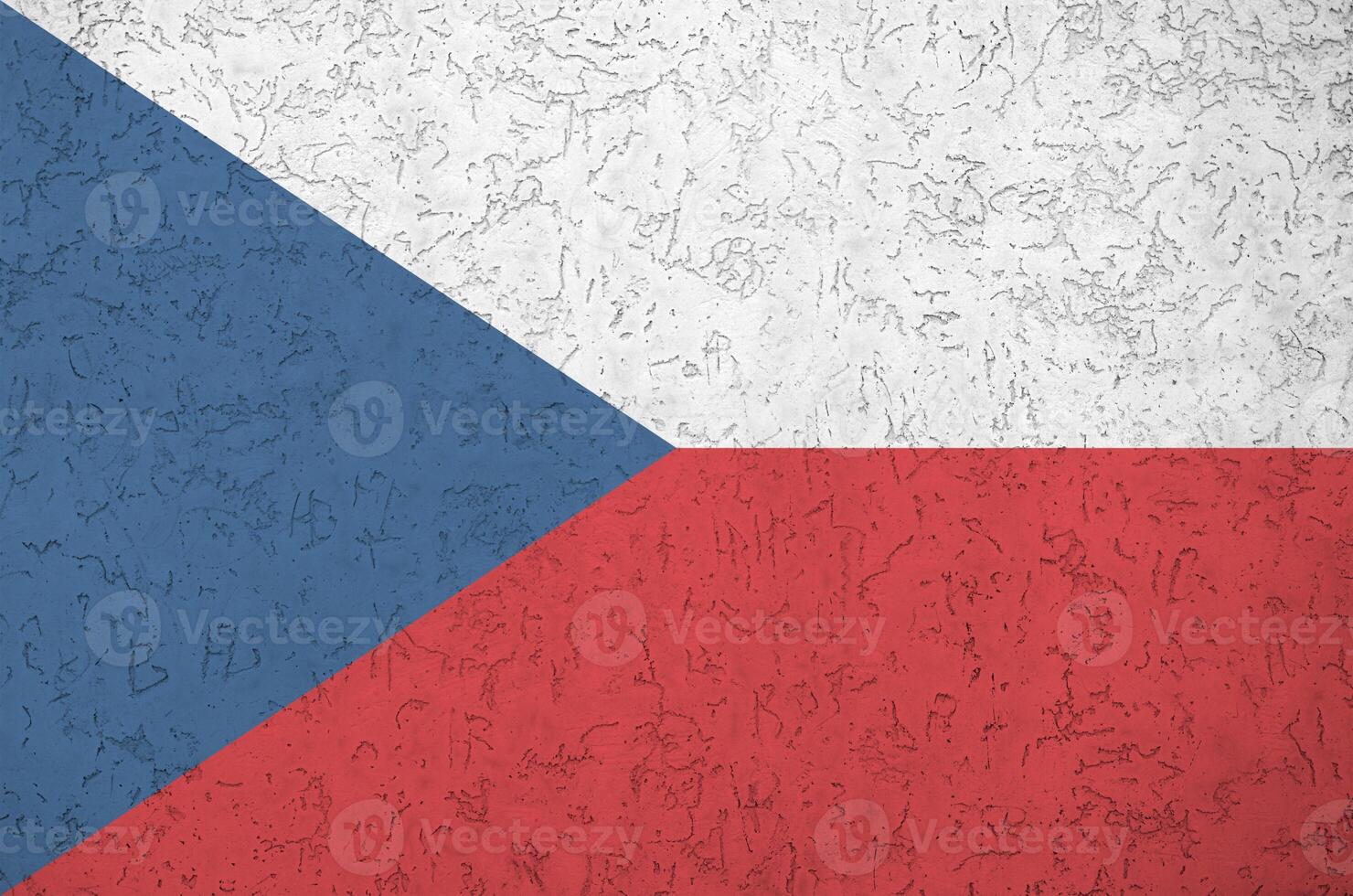 Czech flag depicted in bright paint colors on old relief plastering wall. Textured banner on rough background photo