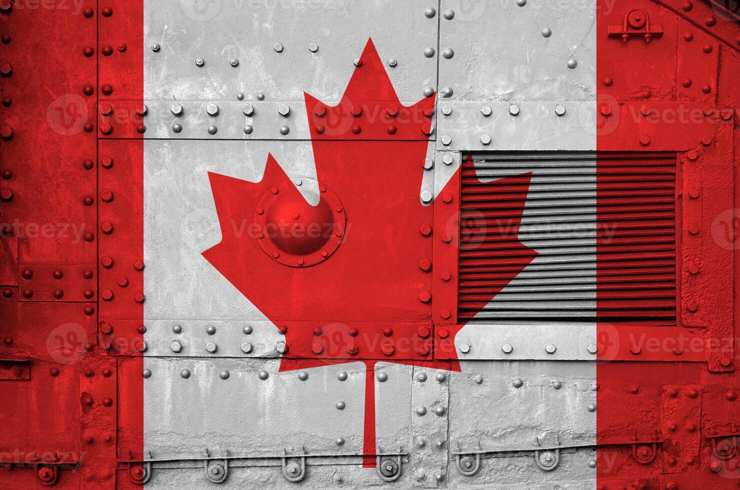 Canada flag depicted on side part of military armored tank closeup. Army forces conceptual background photo