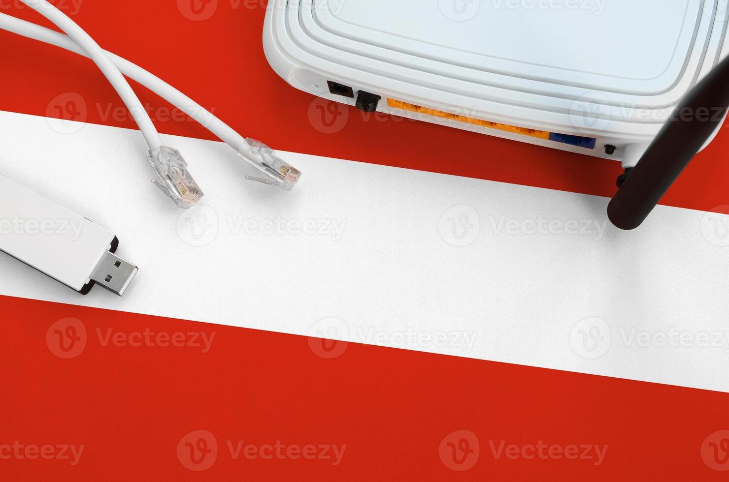 Austria flag depicted on table with internet rj45 cable, wireless usb wifi adapter and router. Internet connection concept photo