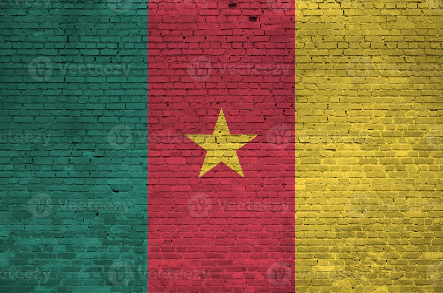 Cameroon flag depicted in paint colors on old brick wall. Textured banner on big brick wall masonry background photo