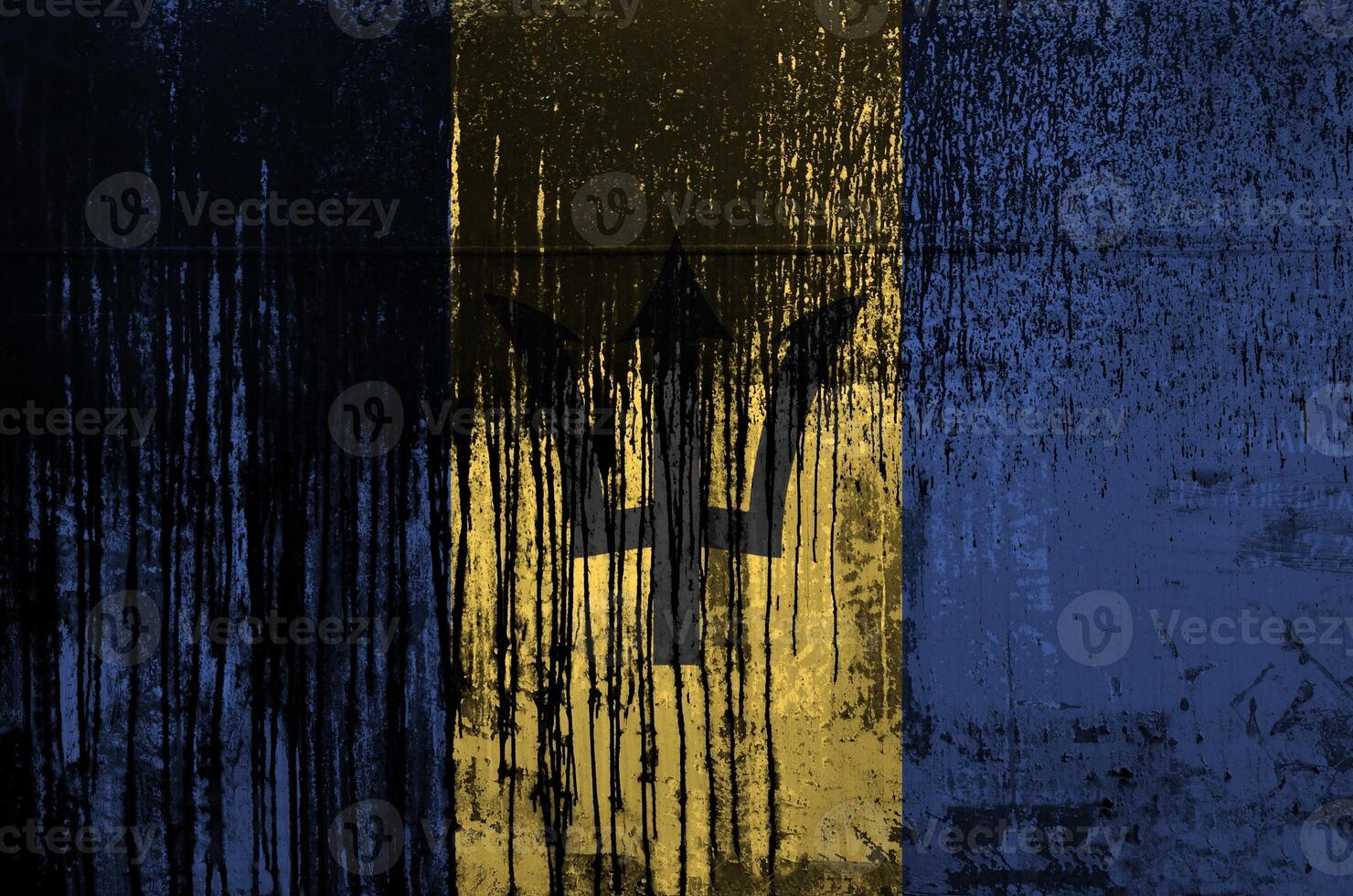 Barbados flag depicted in paint colors on old and dirty oil barrel wall closeup. Textured banner on rough background photo