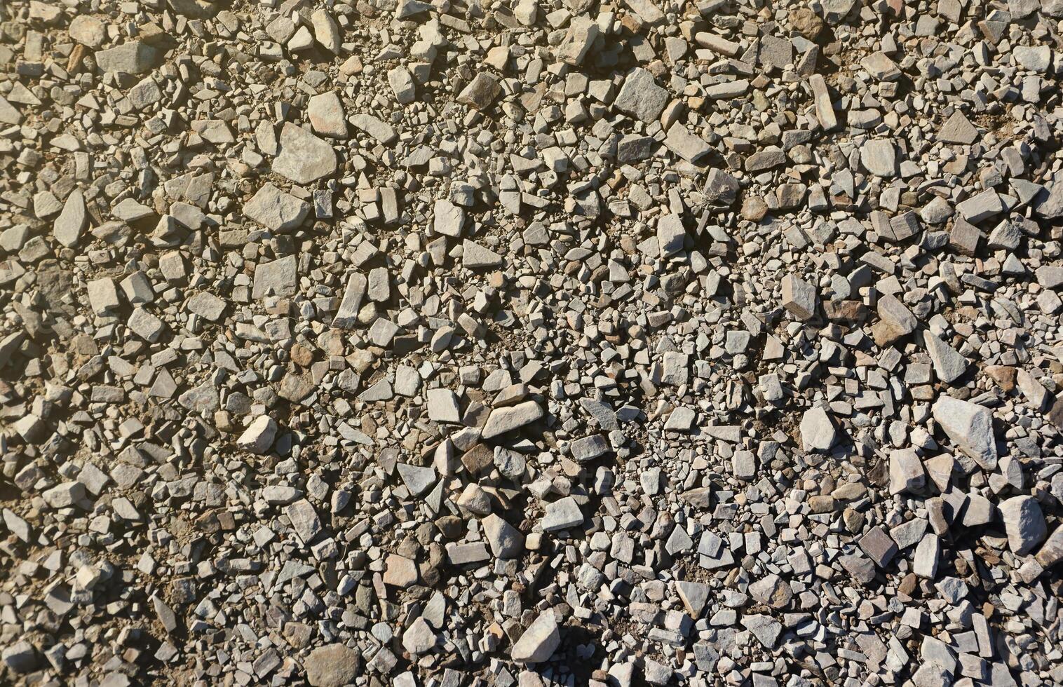 Background of shattered stony stones surface in mountain area. Texture with natural light photo