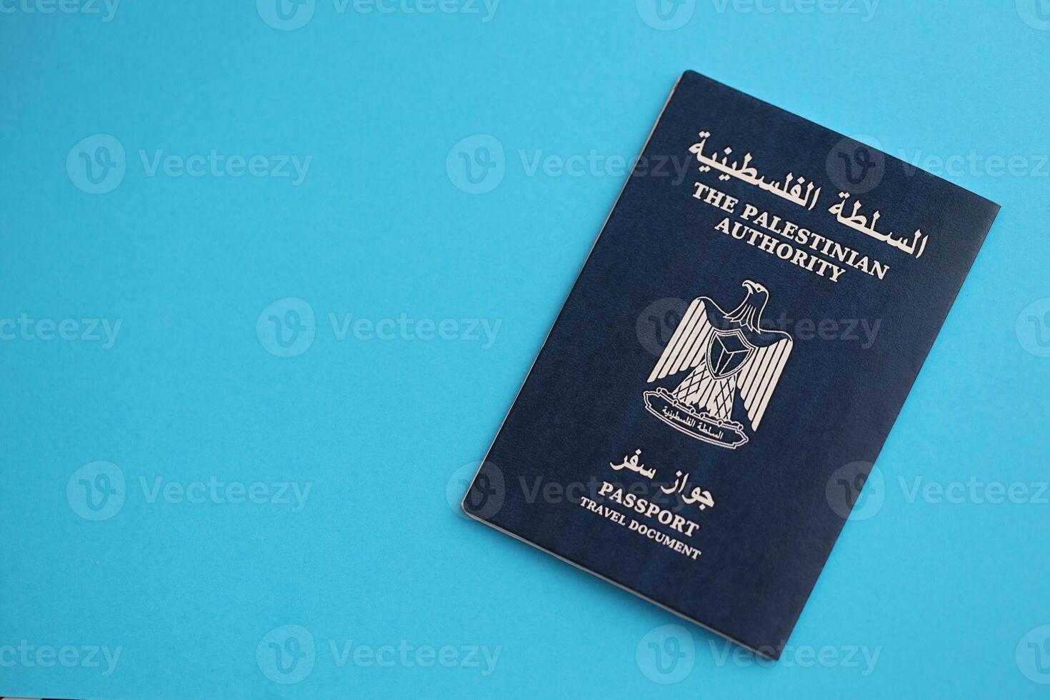 Blue Palestinian Authority passport on blue background close up photo