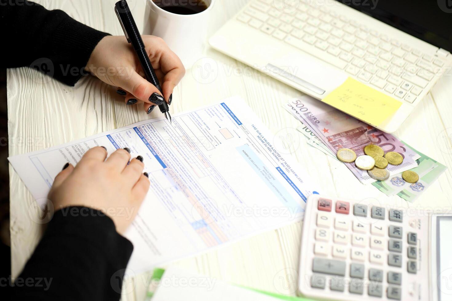 Accountant fill french tax form 10963 Value added tax and similar taxes in end of tax period. Taxation and paperwork routine photo