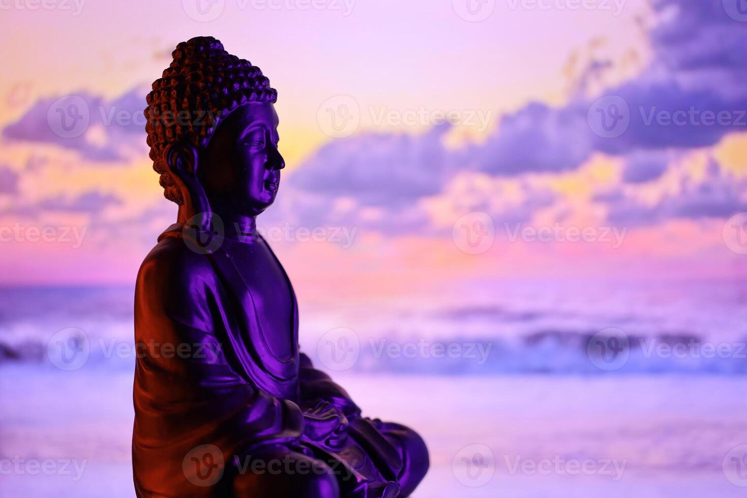 Buddha Purnima and Vesak day concept, Buddha statue with low key light against beautiful and colorful background. Meditation photo