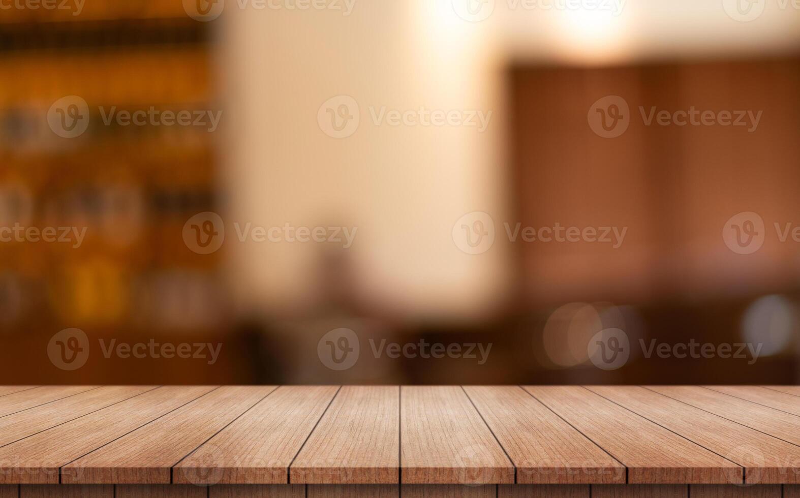 Empty wooden table top with lights bokeh on blur restaurant background photo