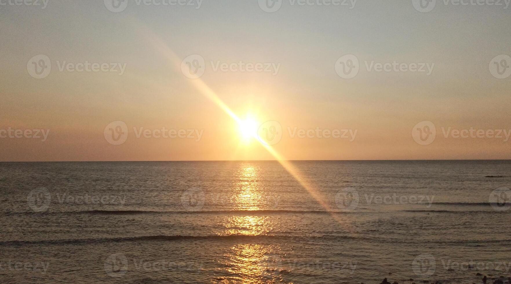 Sunset over the sea. Beautiful sunset on the sea. The sun goes down. photo