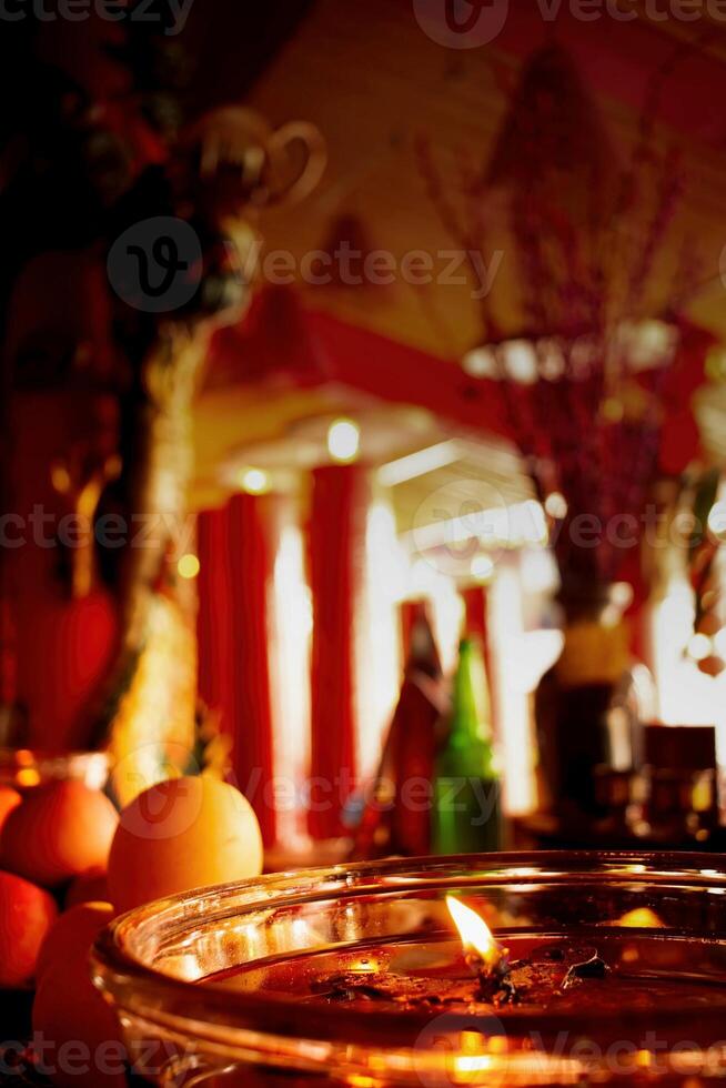 candlelight in the temple prayer room during Chinese New Year celebrations photo