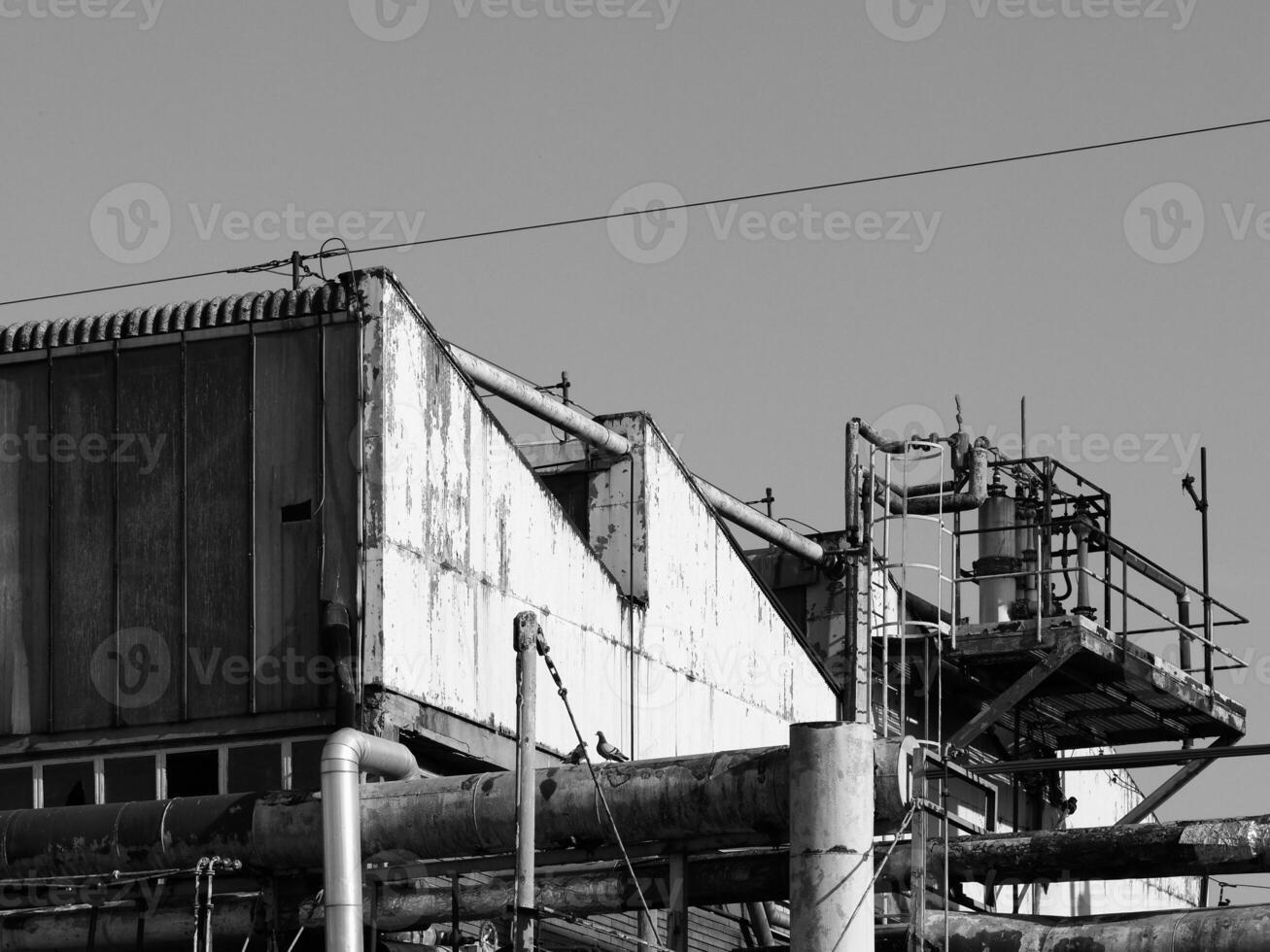 abandoned factory ruins in black and white photo