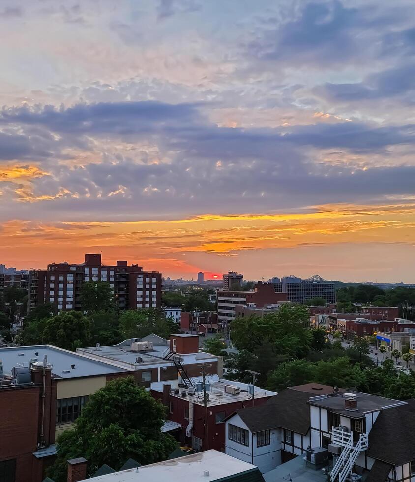 colourful cloudy sunrise over the town photo