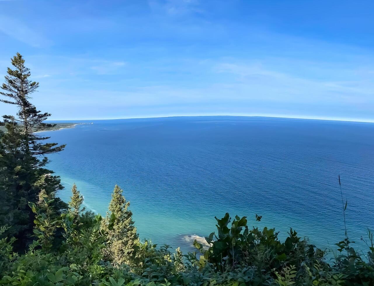 clear blue water of the ocean seen from a mountain photo