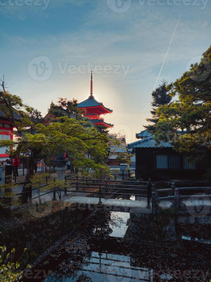 Bridge Over Water And Shrine In The Background photo