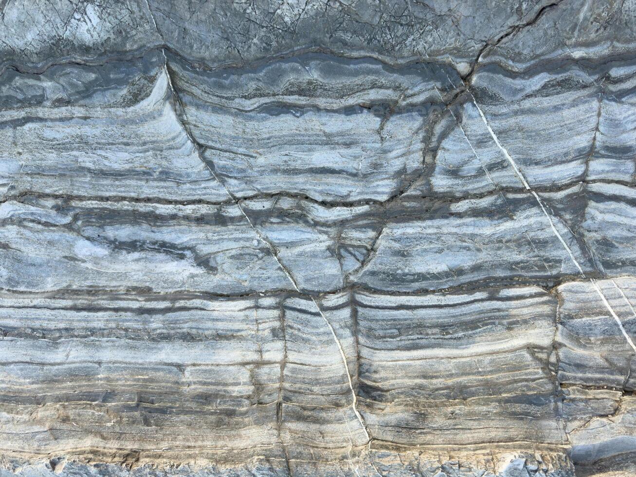 Light white rock texture. Mountain rough surface photo