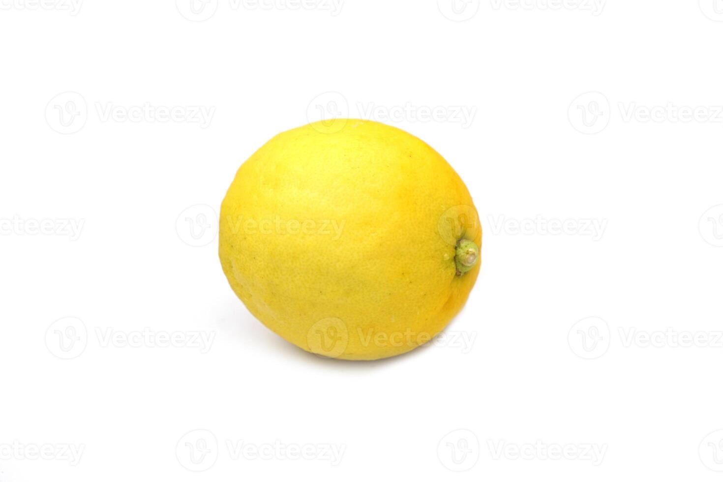 isolated lemon fruit on white background. The fruit is round and oval. The young fruit is green. When cooked it will be yellow. The fruit flesh is juicy and sour taste. photo