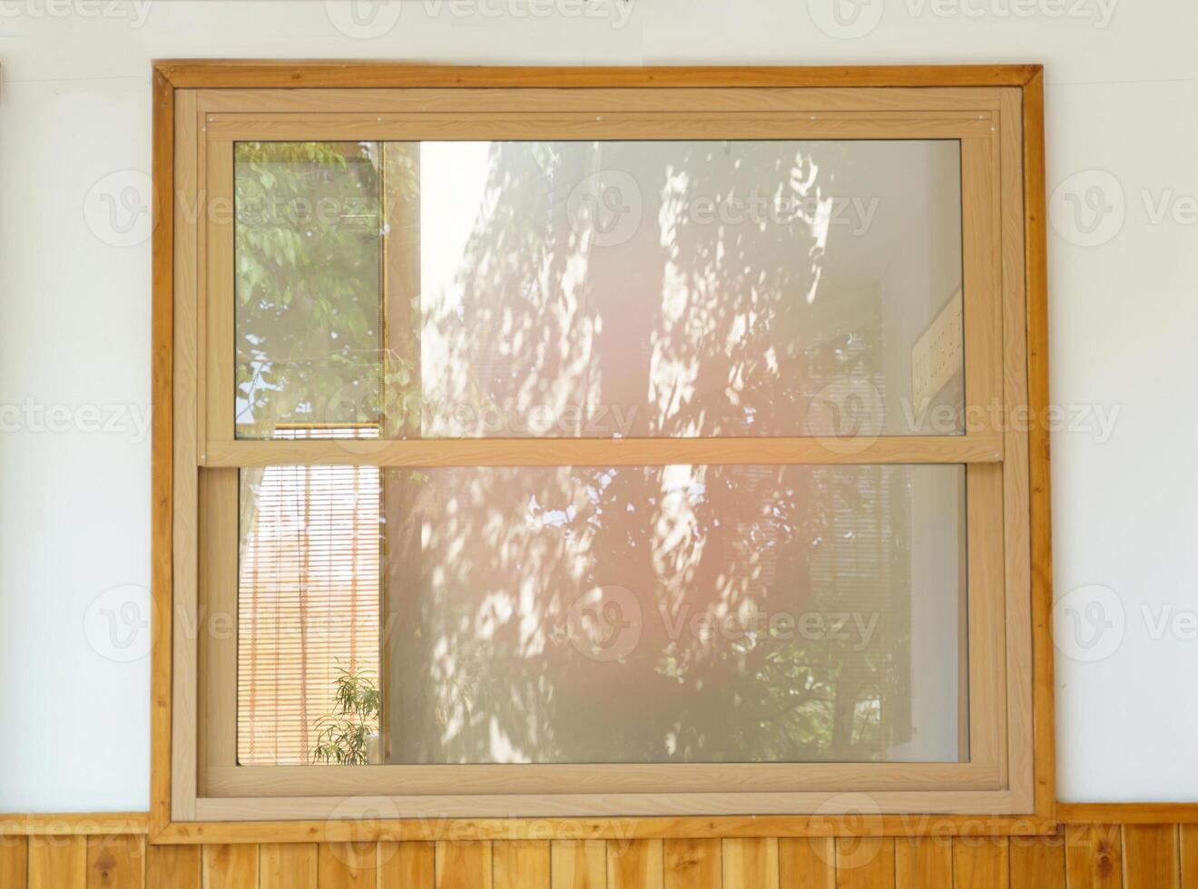 Sash Windows, wooden frames are sliding windows, but they slide upward instead, not taking up space in the swing when opening. Most are fixed doors above. and a raised door at the bottom photo