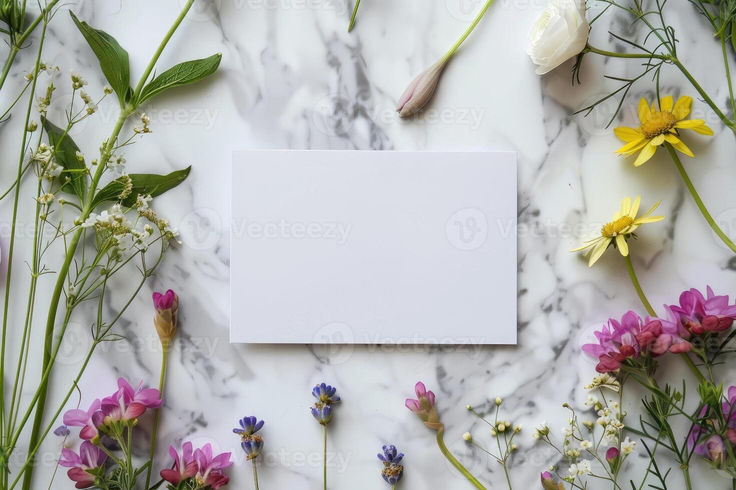 AI generated Blank white card on Marble table with meadow spring flowers around, top view. Festive floral summer arrangement mockup for invitations and contact details. Springtime copy space photo
