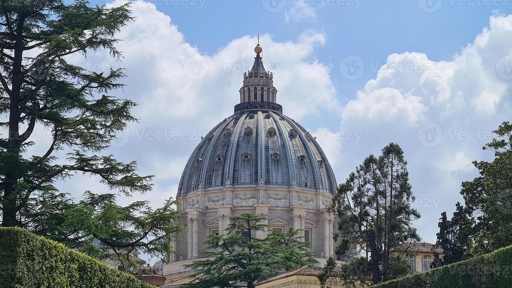The dome of St. Peter's Basilica in Vatican City is a stunning architectural marvel, designed by Michelangelo and towering over the city skyline. photo