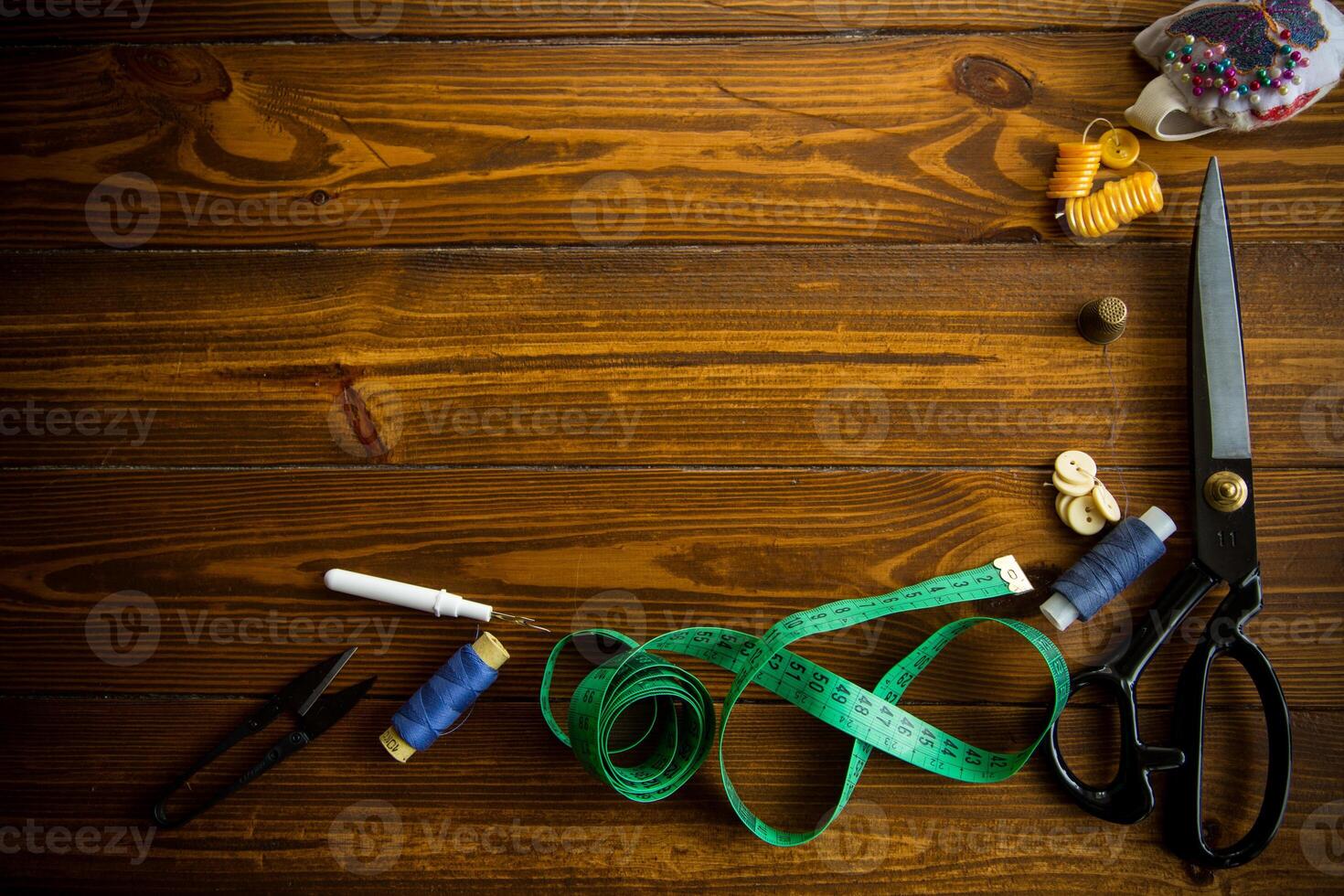 a set of tools and threads for sewing clothes photo