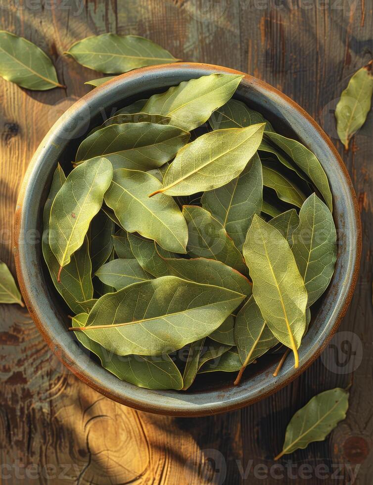 AI generated Bay leaves in bowl on wooden table photo