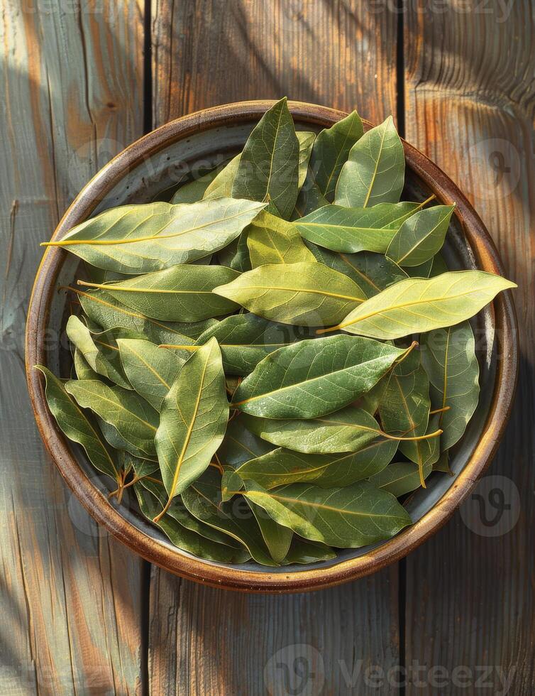 AI generated Bay leaves in bowl on wooden table photo