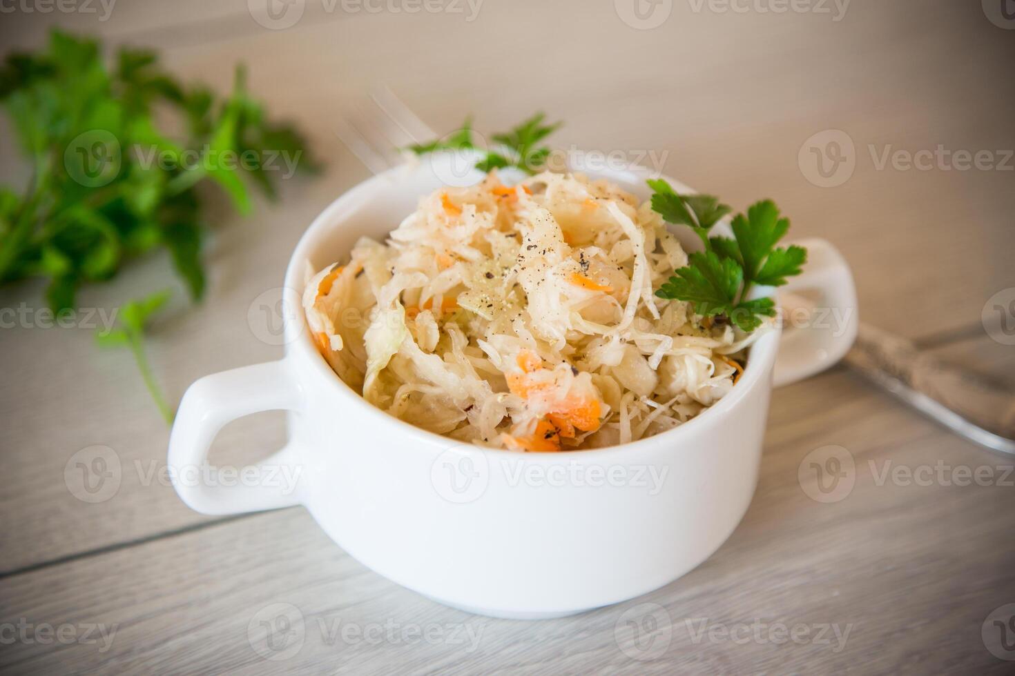 sauerkraut with carrots and spices in a bowl photo