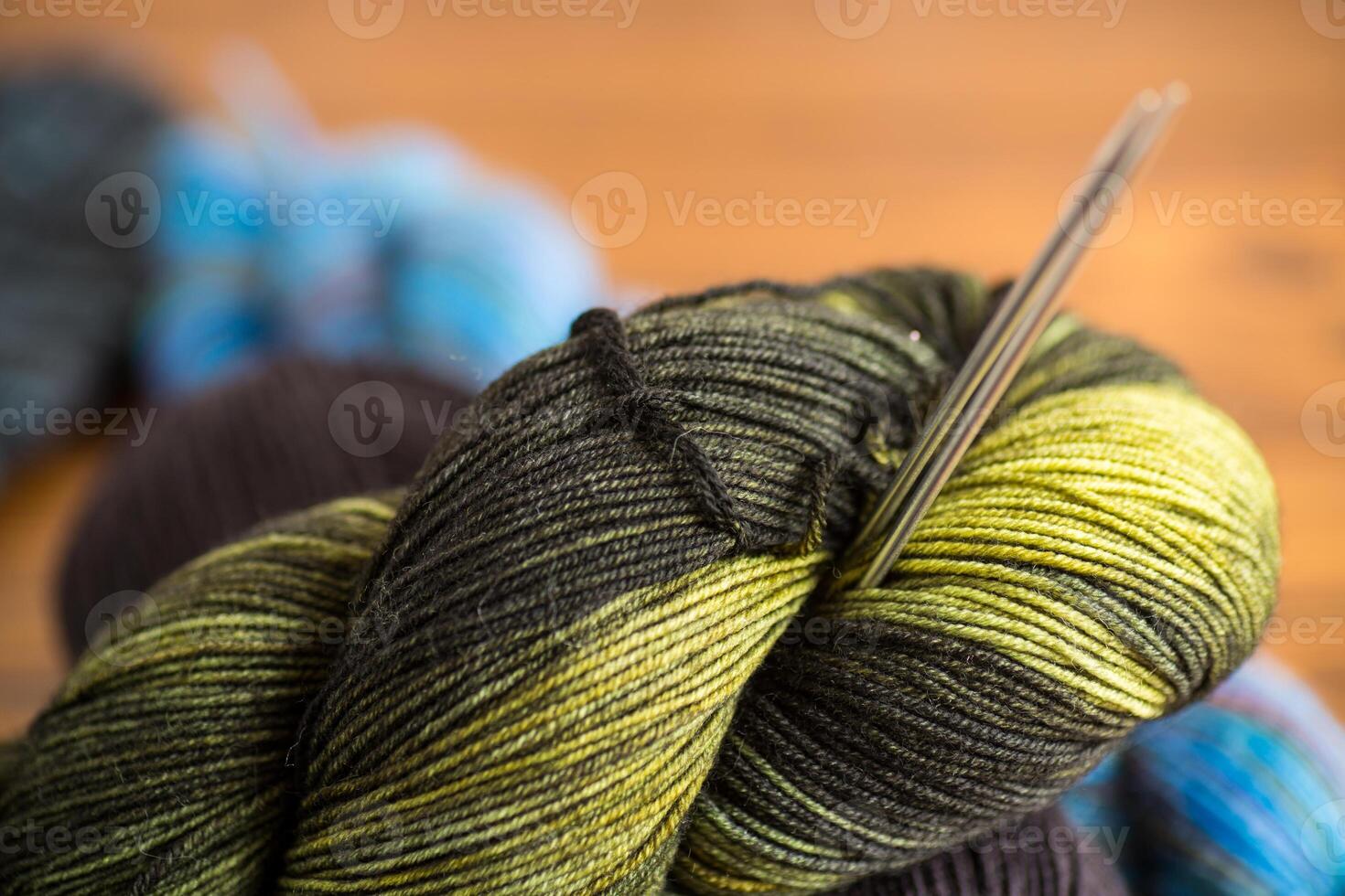 Colored threads, knitting needles and other items for hand knitting photo