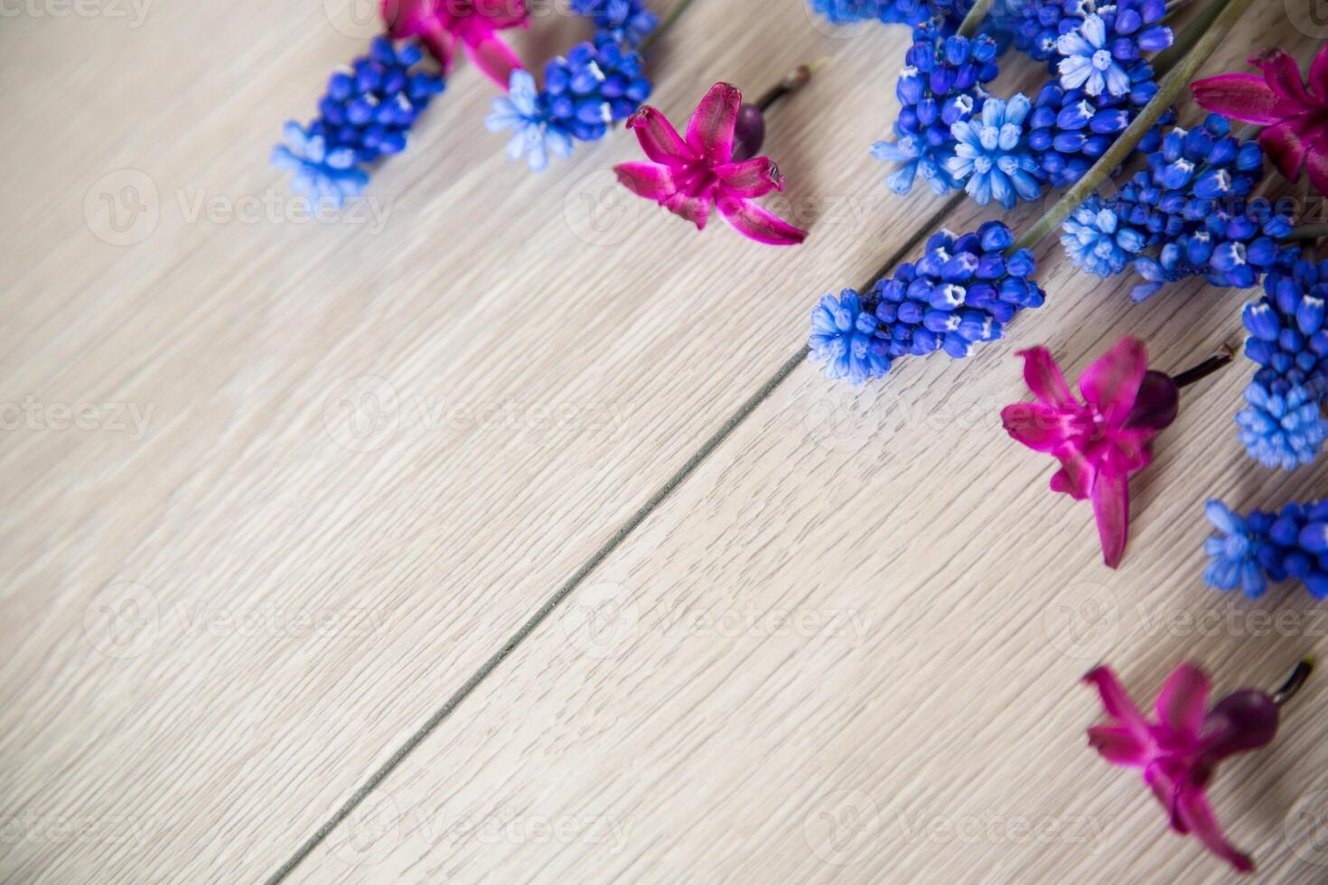 beautiful bouquet of spring flowers on a wooden table photo