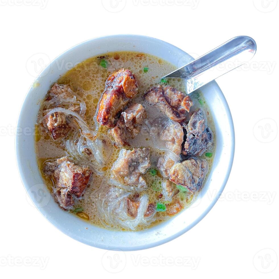 Top View of Coto Makassar, traditional food of South Sulawesi, Indonesia. Made with beef and many spices. isolated on white photo