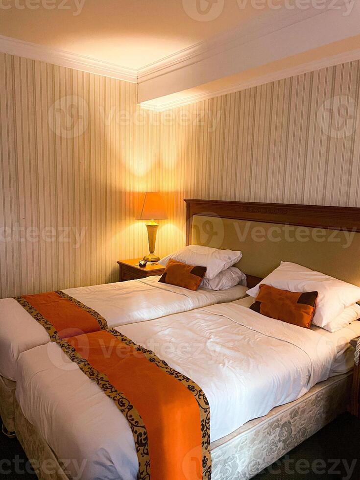 modern hotel room interior view with two single bed photo