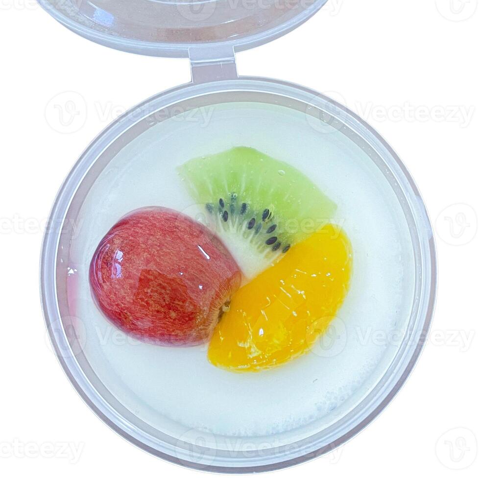 Delicious pudding with fresh grapes , orange and kiwi fruit on a cup. top view. isolated on white photo