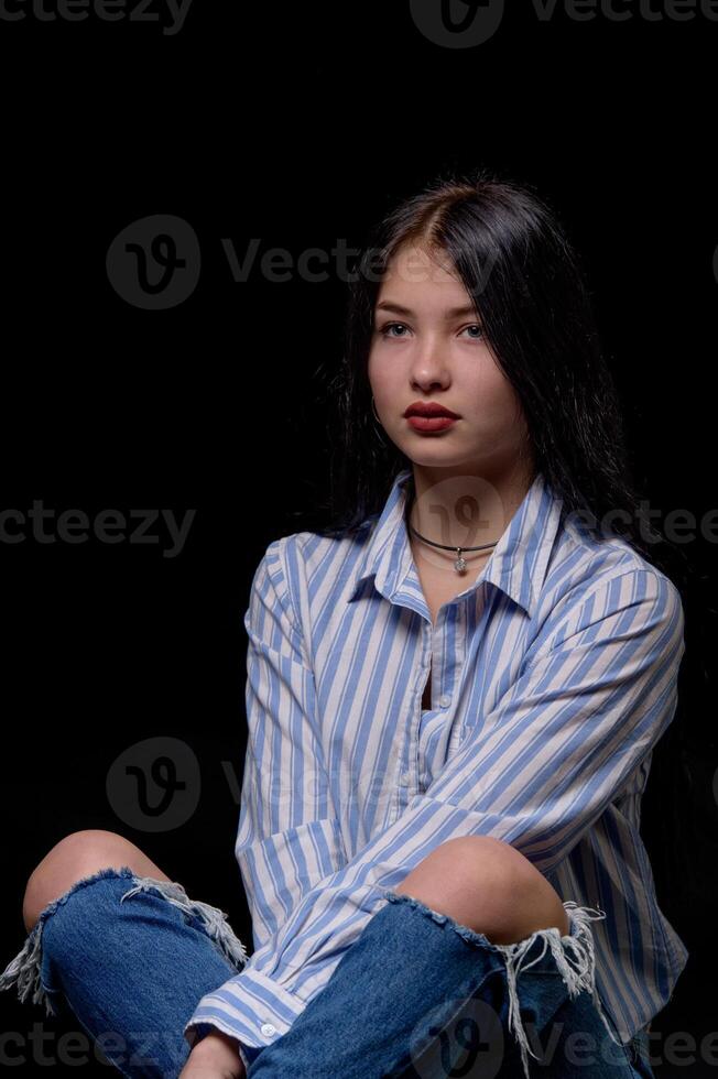 studio portrait of a young girl wearing a striped shirt 1 photo