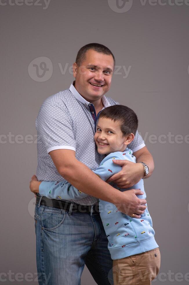 Portrait of dad playing with his son 1 photo