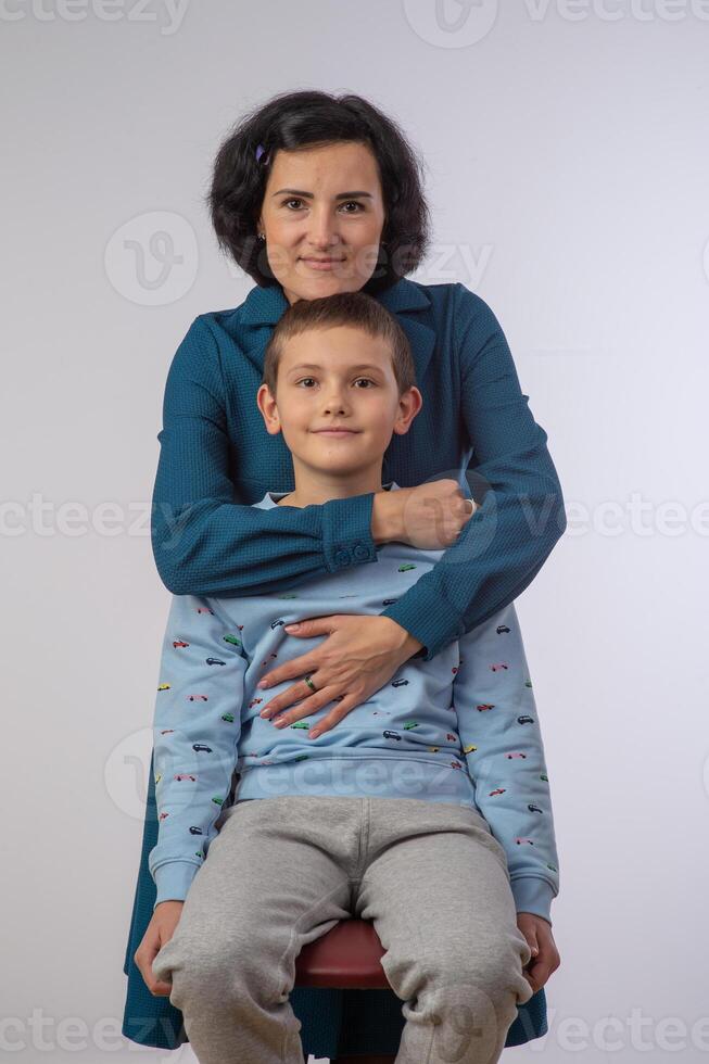 mother and son studio portrait happy family 1 photo