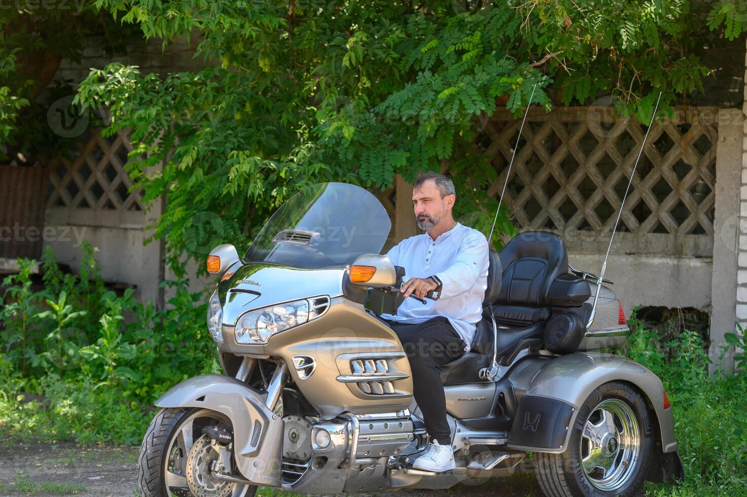 man sitting on a motorcycle 2 photo