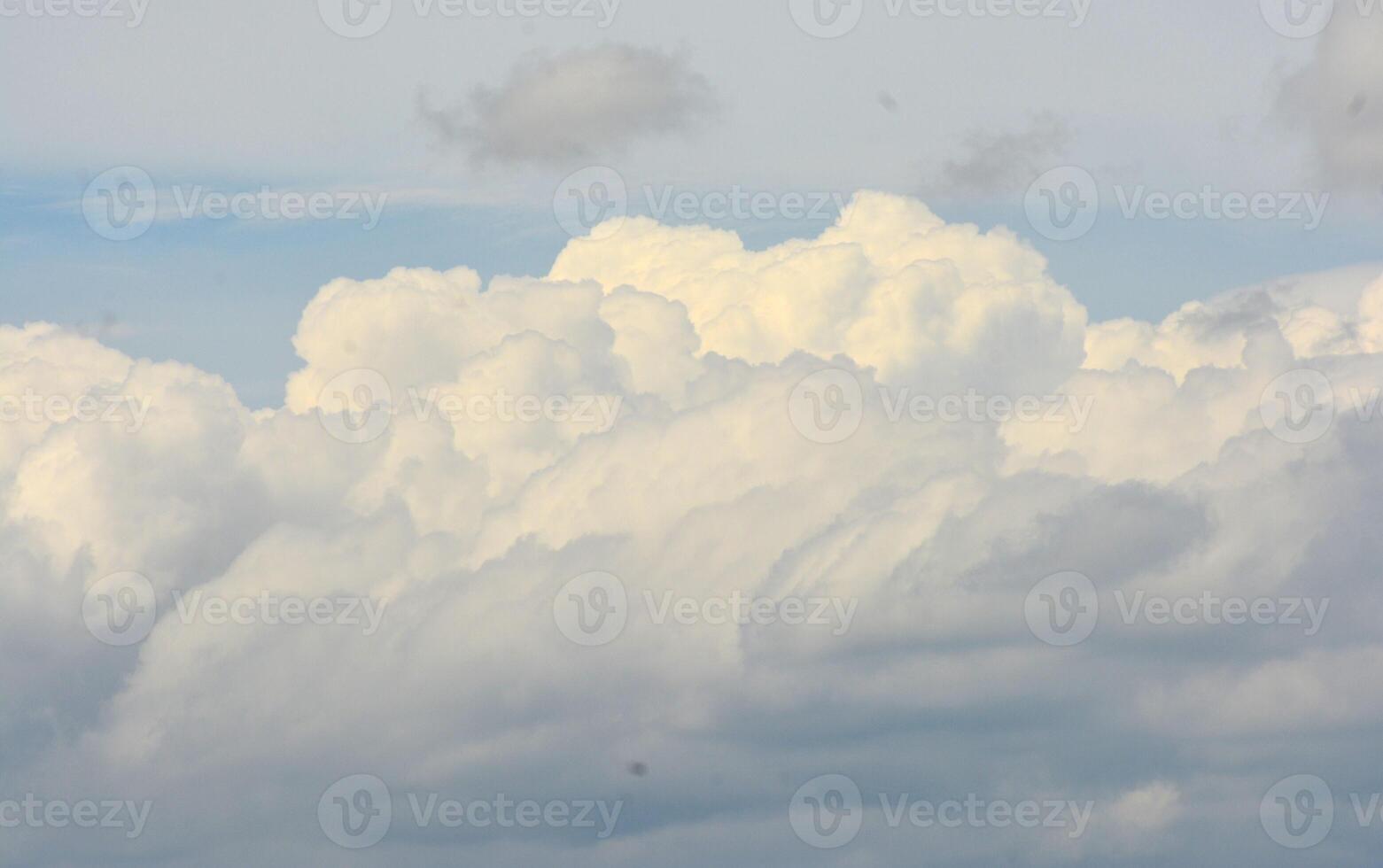 photo of white clouds and clear blue sky in summer
