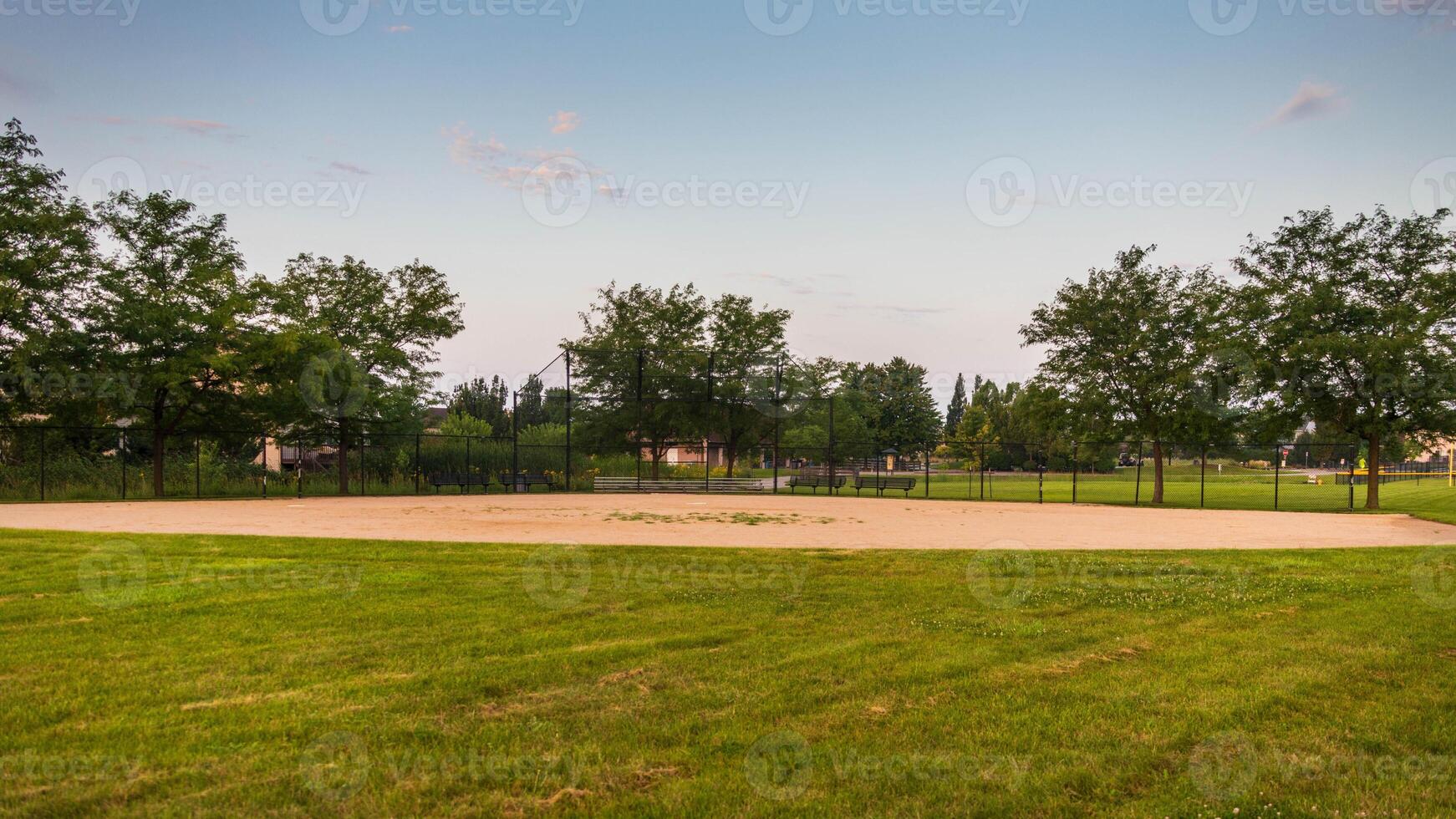 looking in towards home plate of this baseball field from right field photo