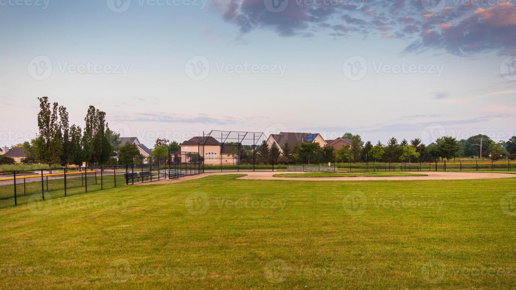 looking in towards home plate of this baseball field photo