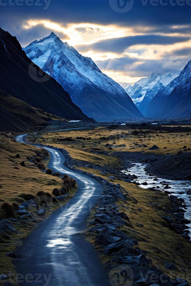 AI generated Beautiful vertical scenic view of a rural gravel road after rain in a mountain valley under a cloudy sky photo