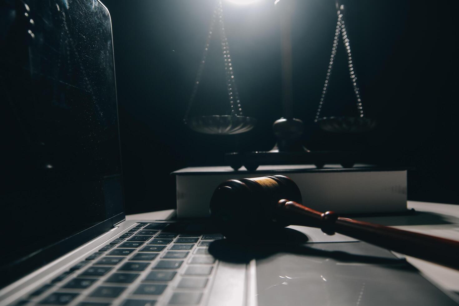 image of judge's hammer, scales lady of justice, law book, laptop computer and contract documents with pen concept of law and justice. photo
