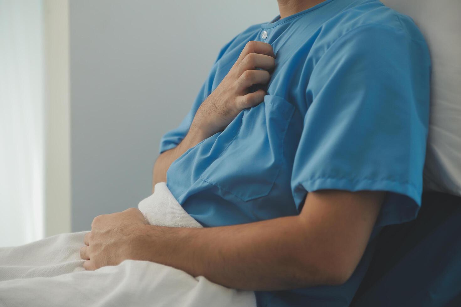 Male patient consulting a medical specialist at hospital. Chest pain and inflammatory heart disease photo