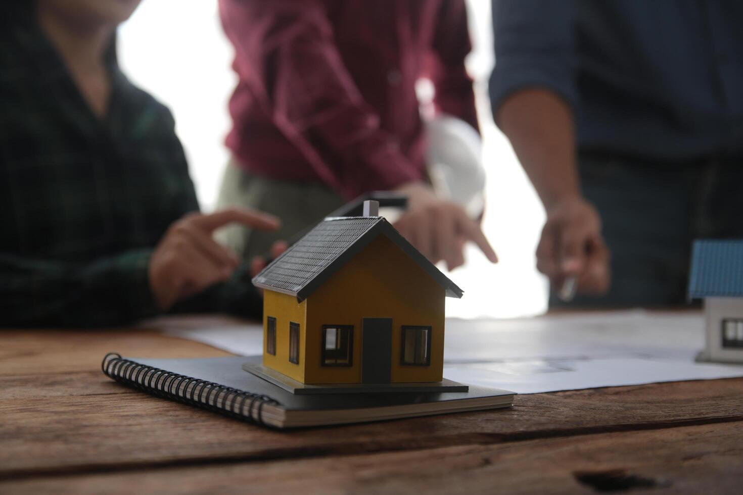 Diverse Team of Specialists Use Laptop on Construction Site. Real Estate Building Project with Engineer Investor and Businessman Checking Area, working on Civil Engineering, Discussing Strategy Plan photo