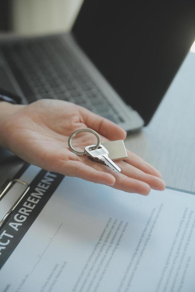 Real estate agent and customer signing contract to buy house, insurance or loan real estate.rent a house,get insurance or loan real estate or property. photo