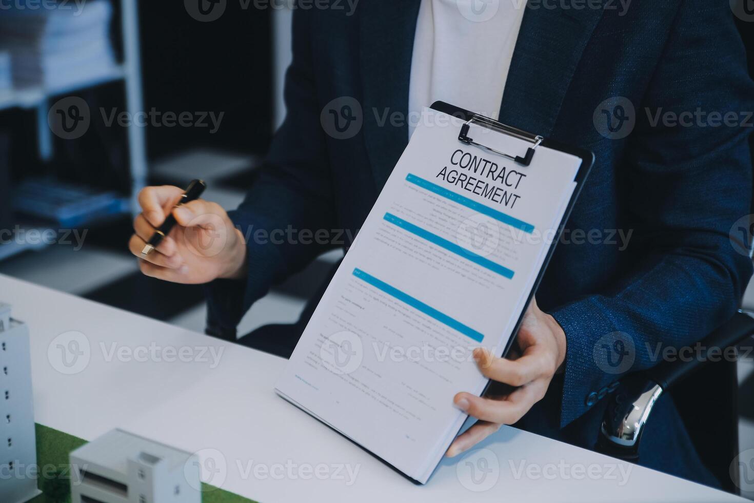 Real estate agent talked about the terms of the home purchase agreement and asked the customer to sign the documents to make the contract legally, Home sales and home insurance concept. photo