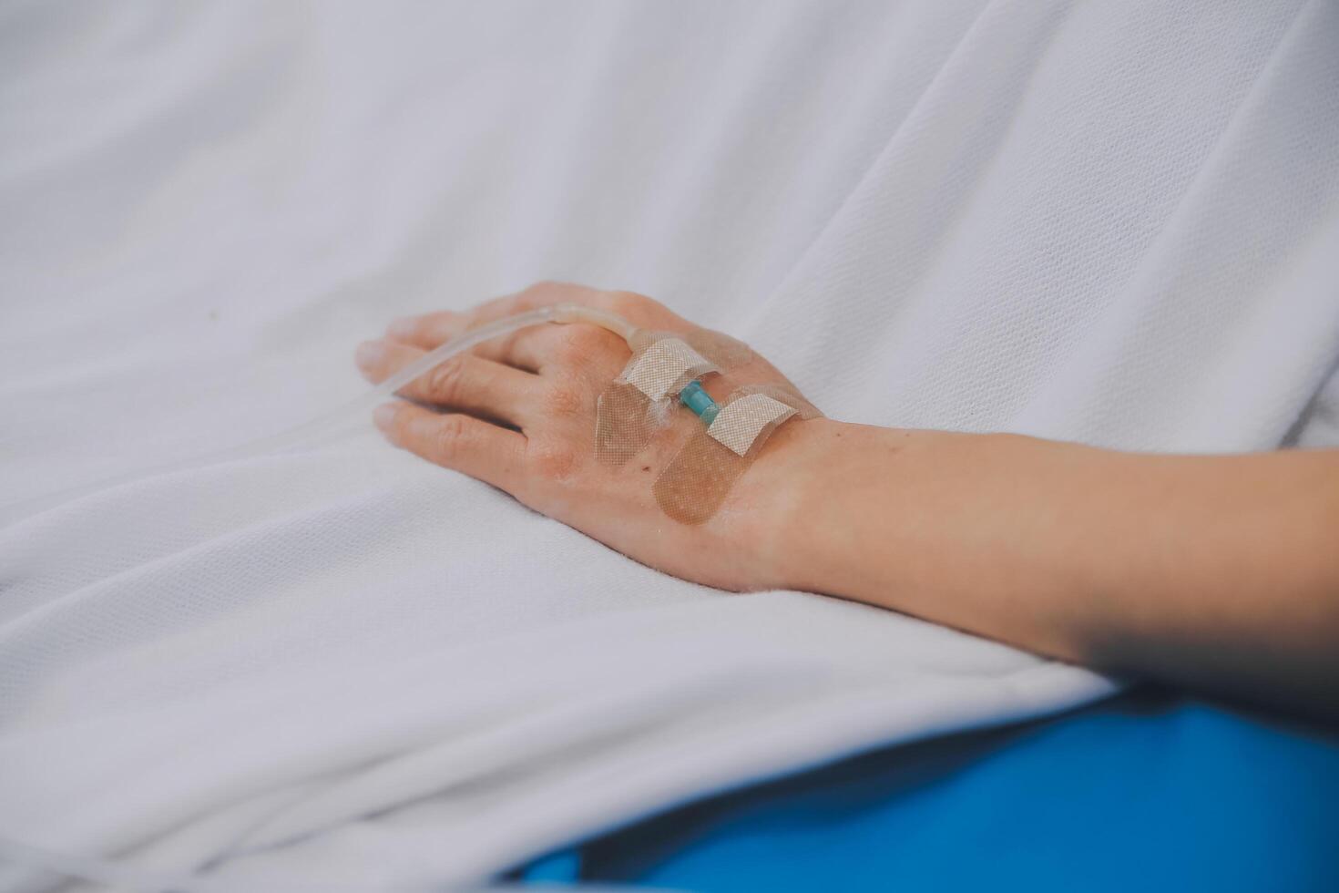 Asian Doctor make routine health check with patient in hospital ward photo