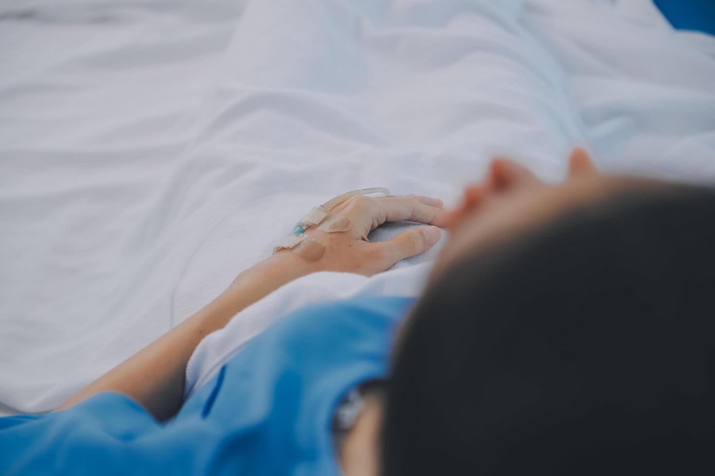 Asian Doctor make routine health check with patient in hospital ward photo