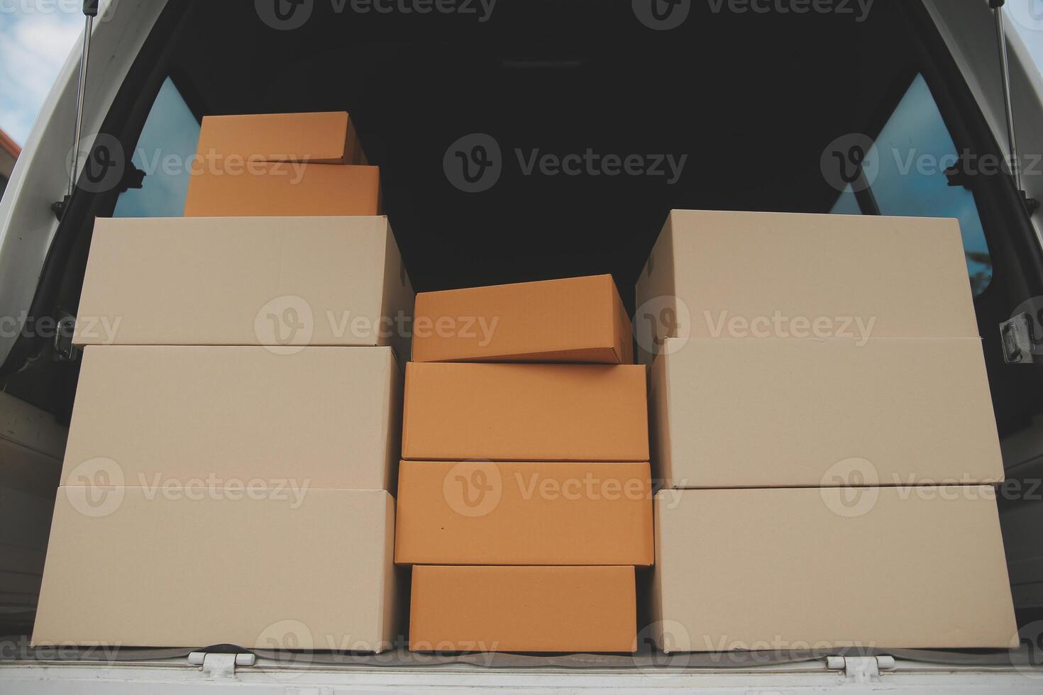 Asian delivery express courier young man use giving boxes to woman customer he wearing protective face mask at front home photo